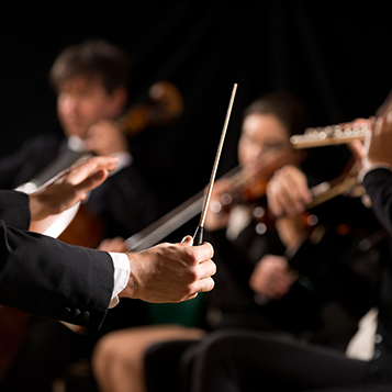 Conductor directing symphony orchestra